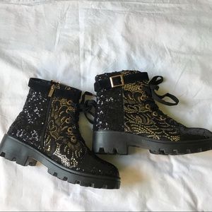 Black and gold combat boots